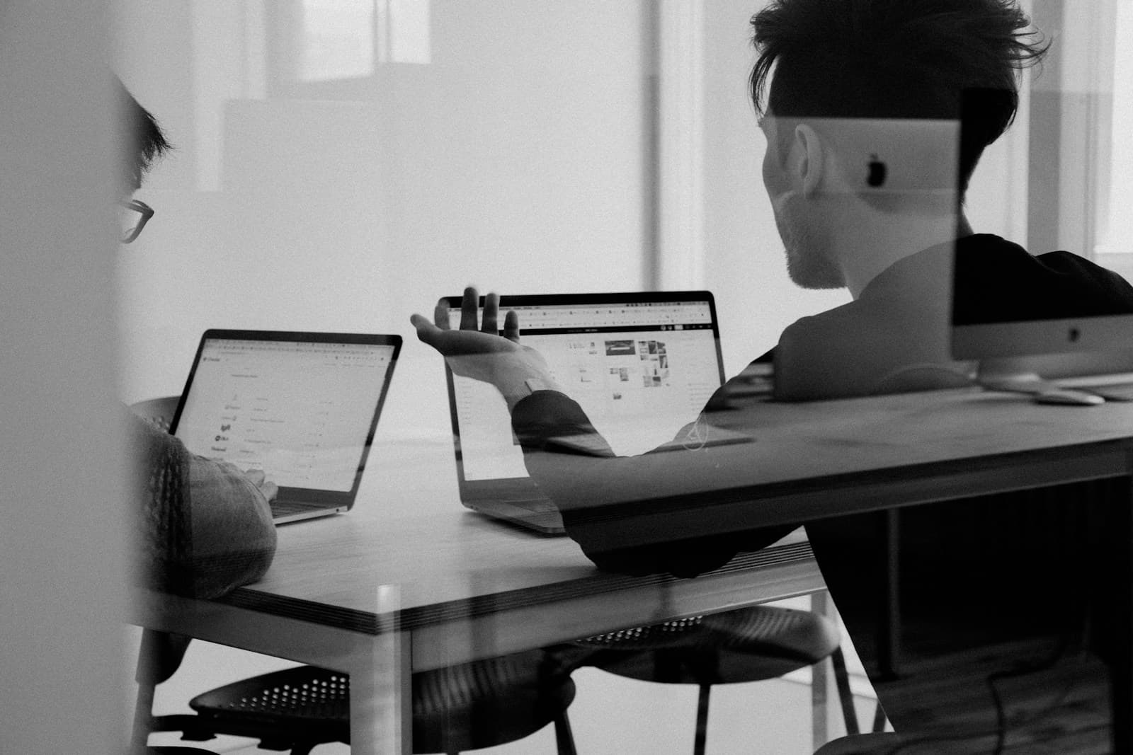 Team meeting around a whiteboard (photo from Unsplash)
