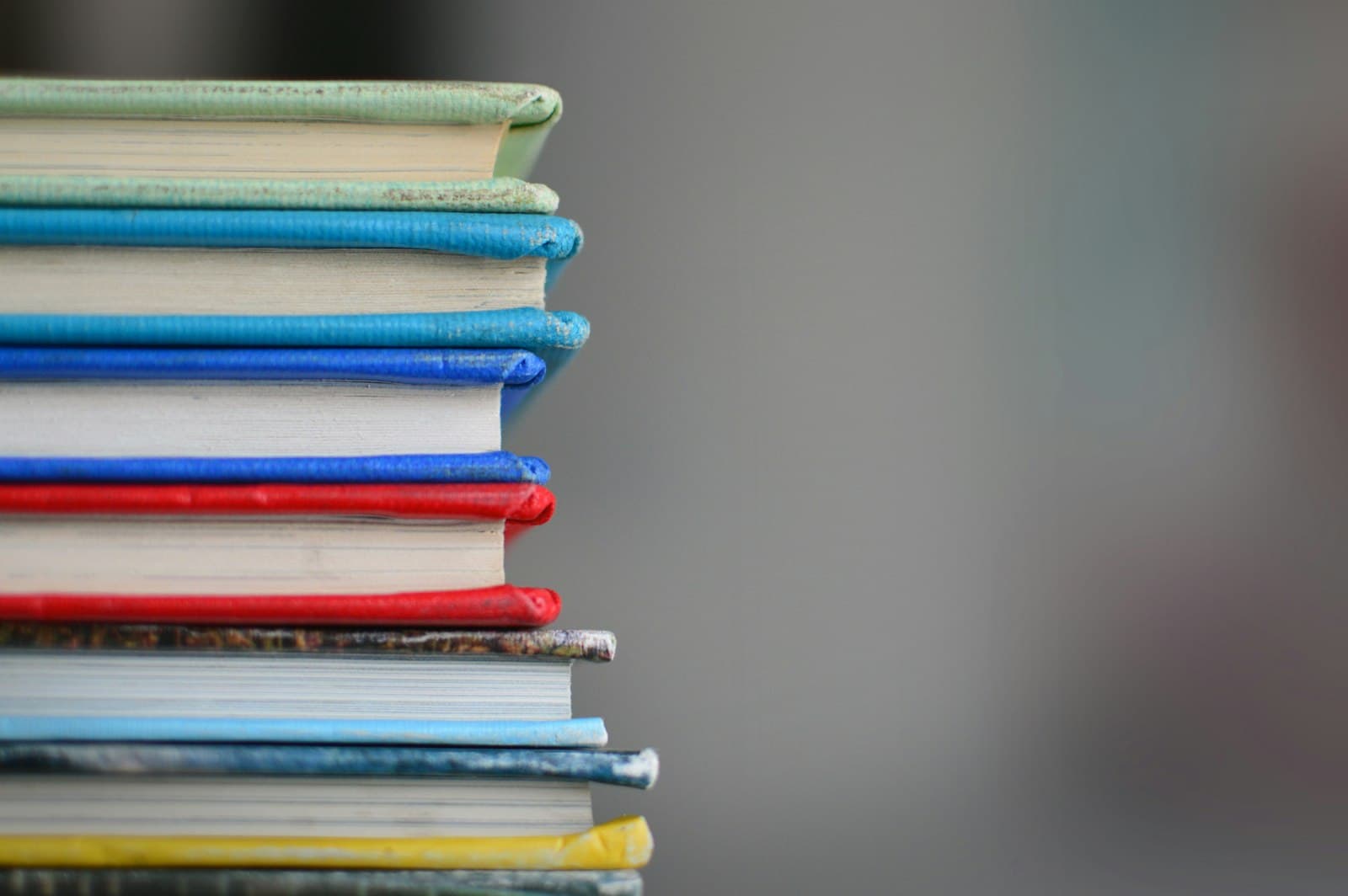 Library shelves filled with reference books, representative of the depth of subjects covered.
