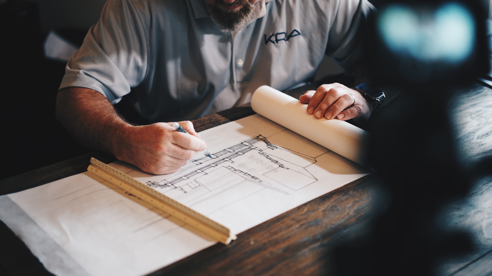 Code and architecture diagrams on a monitor in a development environment (photo on Unsplash)